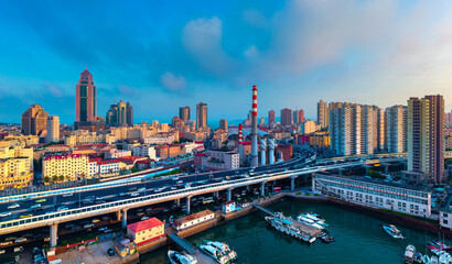 Obraz premium Urban Environment of Qingdao Railway Station and Jiaoning Elevated Road, China