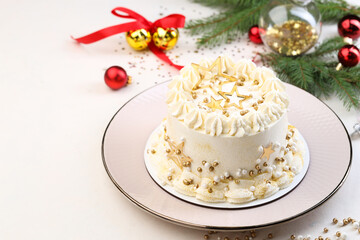 Delicious cake with Christmas decor on white table, closeup