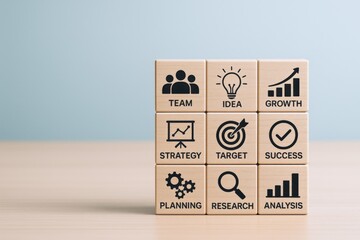Wooden Blocks Displaying Business Success Strategy, Teamwork, Ideas, and Growth Concepts on a Table