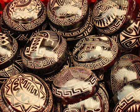 Indigenous bowls, handicrafts from the Brazilian Amazon, made from the fruit of the Cujite Crescentia, decorated with geoglyphs, for sale as souvenirs to tourists in the city of Bel&eacute;m, Par&aacute;, Brazil