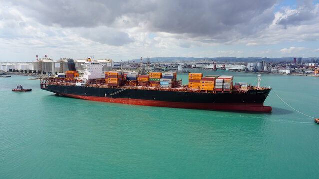Barcelona, Spain - September 26, 2025: Cargo containers Hapag-Lloyd stored on the cargo ships.