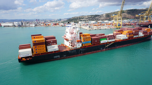 Barcelona, Spain - September 26, 2025: Cargo containers Hapag-Lloyd stored on the cargo ships.