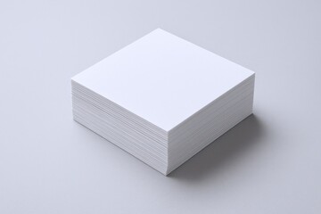 Fototapeta premium Stack of Clean White Paper Sheets on Neutral Background Ready for Printing and Writing