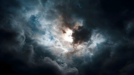 Obraz premium Dramatic storm clouds part to reveal intense sunlight breaking through the dark sky