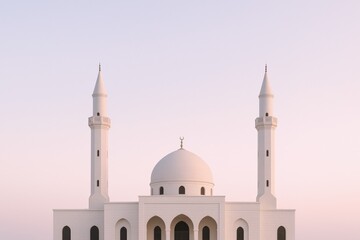 Fototapeta premium Elegant White Mosque with Minarets Against Soft Sky: Architectural Beauty and Spiritual Ambiance