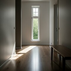 Sunlight streams through a tall narrow window in an empty modern hallway with wooden floors.