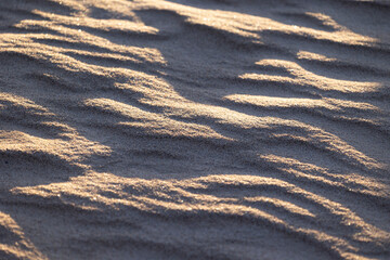 Beautiful sand patterns at the beach of Baltic Sea. Sunny summer evening in Latva.