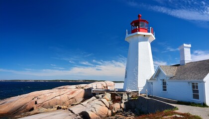peggys cove lighthouse on a sunny day with blue sky