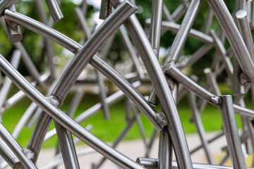 Abstract Intertwined Chrome Metal Tubes Sculpture