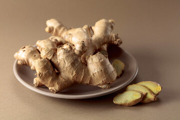 Ginger root on a beige background.
