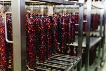 Smoked sausage production line in the factory