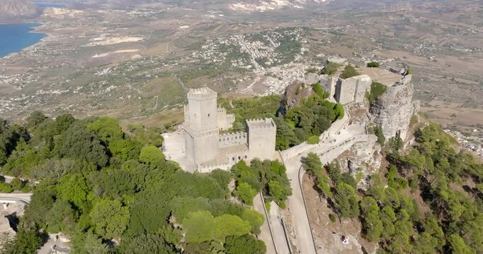 Aerial view of The Balio Towers and the Venus Castle, located in Erice, Sicily, Italy. At the summit of Mount Erice, the towers once served as a key defensive outpost overlooking the sea.