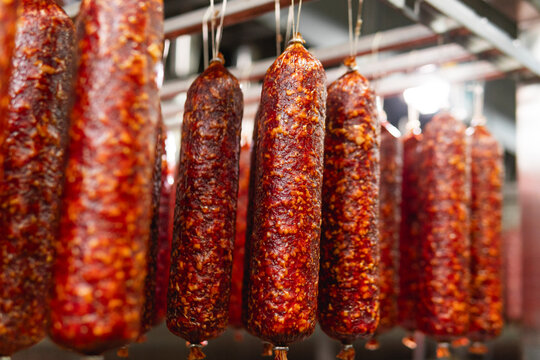 Smoked sausage production line in the factory