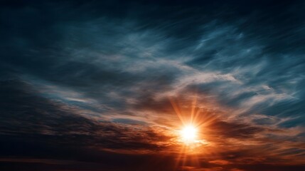 Naklejka premium Dramatic sunset sky with vibrant sunburst rays piercing through dark moody clouds