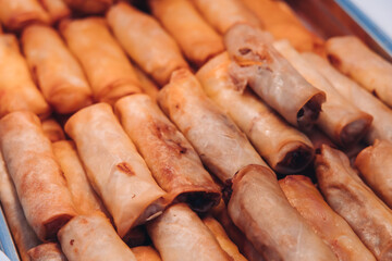 Decorated catering table, banquet with variety of different gourmet exquisite food snacks appetizers on corporate birthday party event or wedding celebration, canape, salad, delicatessen setting