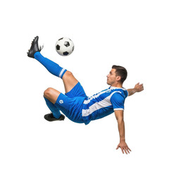 Athletic soccer player in mid air performing a spectacular bicycle kick with a ball isolated on transparent background