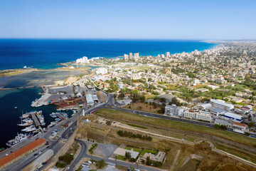 Aerial view of Famagusta city showing harbor with Varosha ghost town on background. Cyprus
