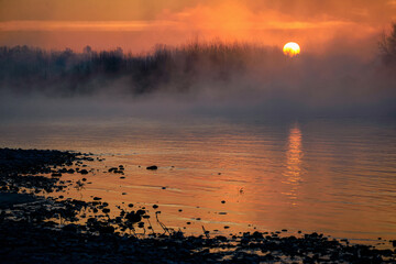 Foggy sunset over the river