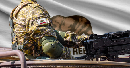 Fototapeta premium California US state flag with soldier at machine gun turret in front of it.