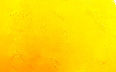 Bright yellow texture. Orange background. Colorful yellow background. Bright yellow grain surface. Rough yellow wall.