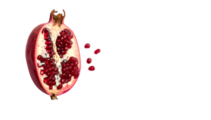 Half a pomegranate reveals vibrant red arils against a stark black backdrop