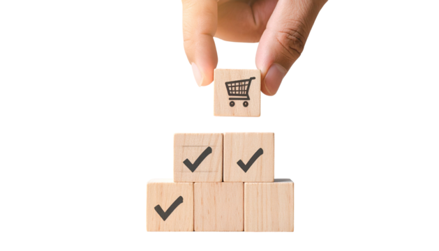 Hand placing a shopping cart cube on a stack of checked boxes, symbolizing completion