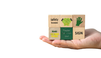 Hand holds wooden blocks with text/icons related to safety, including handshaking and signs