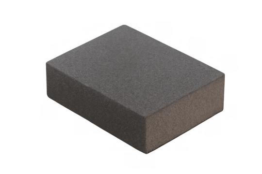 Dark grey foam block showing porous texture