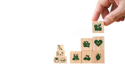 Hand placing a block with an icon on a rising stack; wellness concept