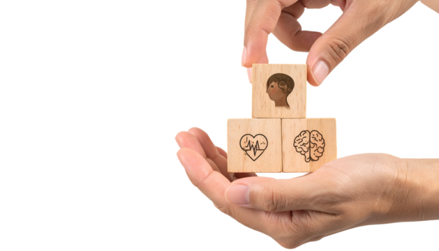 Hands arranging wooden blocks with health icons against black background