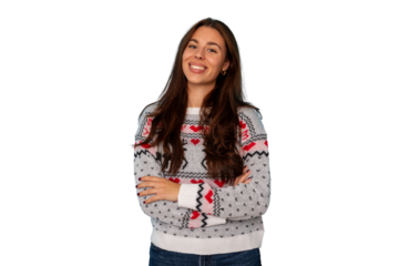 Young woman smiling, wearing a festive christmas sweater with reindeer and hearts, arms crossed with a transparent background