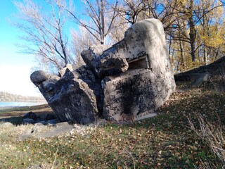A concrete military bunker by the river