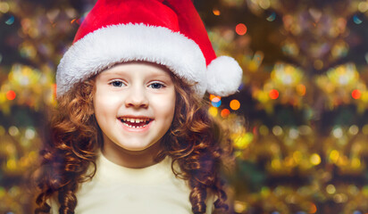 Beautiful girl wearing a Santa hat. Christmas concept.