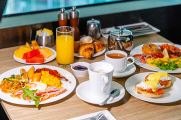 Delicious hotel breakfast spread features eggs, croissants, juice on table in bright dining setting inspires morning dining concept, gourmet cuisine, fresh start, brunch ideas.