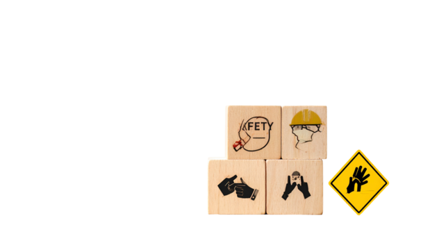 Safety icons on wooden blocks with gloves warning sign against a solid black background