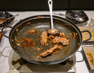 Almost empty pan of Korean beef bulgogi stew or Bulgogi Jeongol.