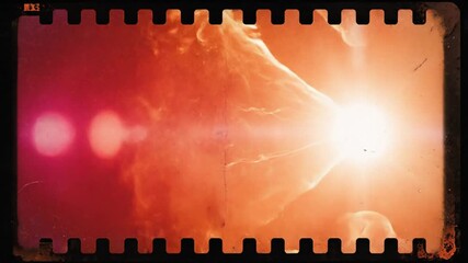 Abstract film frame with orange light and flares textured vintage style background copy space