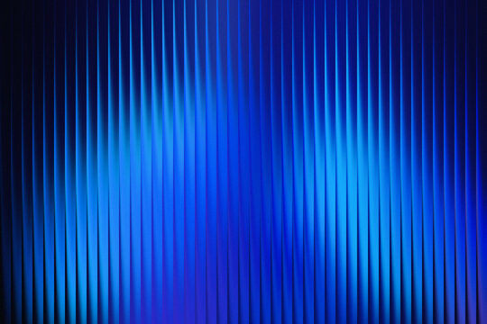 Abstract vertical glowing blue light streaks and lines creating a futuristic and energetic background effect