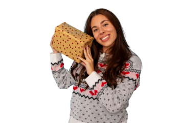 Happy young woman receiving christmas gift on holiday, wearing festive sweater, celebrating winter surprise