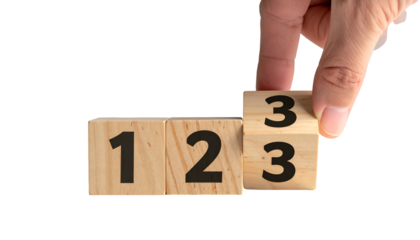 Hand flips a wooden block to reveal "3", creating sequence "1, 2, 3
