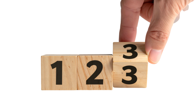 Hand flips a wooden block to reveal "3", creating sequence "1, 2, 3