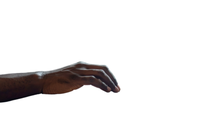 A dark-skinned hand, illuminated from above, is seen against a black background
