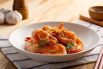 Stir Fried Shrimp with Garlic and White Pepper in white plate. ,Thai Style Food(Goong Tod Kratiem Prik Thai)