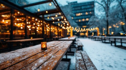Obraz premium Winter outdoor cafe setting. Cozy and inviting atmosphere, with wooden tables, string lights, and gentle snowfall.