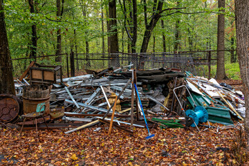 A pile of junk and debris in a wooded area