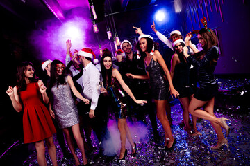 Funny party night dance celebration with stylish friends at a neon club and festive christmas vibe showcasing dancing crowd and music energy and big smiles
