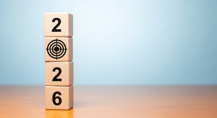 2026 Target Vision: A precise vision for the year 2026 is symbolized by stacked wooden blocks, each carefully inscribed, emphasizing the goal-oriented approach for future achievement.