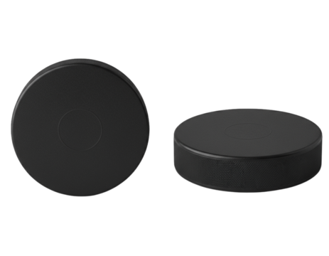 Hockey pucks: The black disc, a tool for ice hockey, sits against a neutral background. This image showcases the puck's simple yet essential form, with clear textures