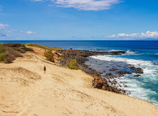Female Hiker Climbing The Sand Dunes on Pu'u Koa'e, Po'olua Beach, Molokai, Hawaii, USA