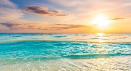Obraz premium Serene tropical ocean sunset with golden sun and turquoise waves
